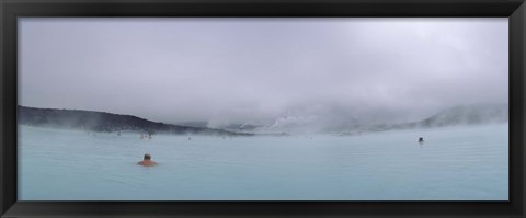 Framed Tourist swimming in a thermal pool, Blue Lagoon, Reykjanes Peninsula, Reykjavik, Iceland Print