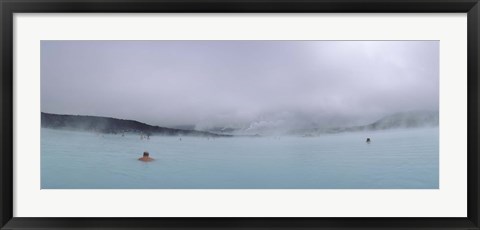 Framed Tourist swimming in a thermal pool, Blue Lagoon, Reykjanes Peninsula, Reykjavik, Iceland Print