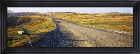 Framed Gravel road passing through a landscape, Cape Bonavista, Newfoundland, Newfoundland and Labrador, Canada Print