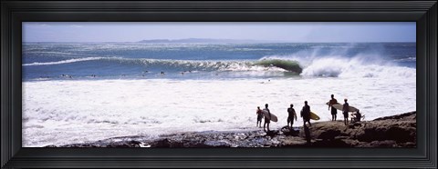 Framed Silhouette of surfers standing on the beach, Australia Print