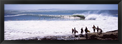 Framed Silhouette of surfers standing on the beach, Australia Print