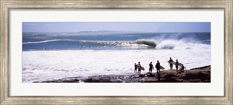 Framed Silhouette of surfers standing on the beach, Australia Print