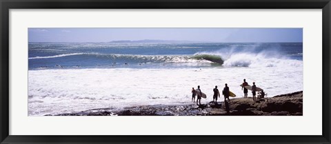 Framed Silhouette of surfers standing on the beach, Australia Print