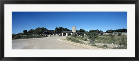 Framed Road leading towards the entrance of a rest camp, Okaukuejo, Etosha National Park, Kunene Region, Namibia Print