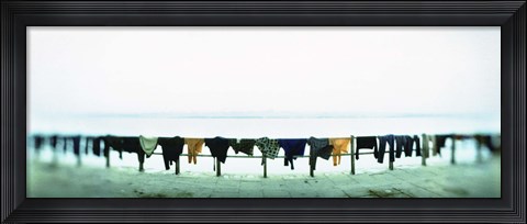 Framed Clothes drying at the riverbank, Ganges River, Varanasi, Uttar Pradesh, India Print