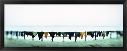 Framed Clothes drying at the riverbank, Ganges River, Varanasi, Uttar Pradesh, India Print