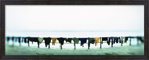 Framed Clothes drying at the riverbank, Ganges River, Varanasi, Uttar Pradesh, India Print