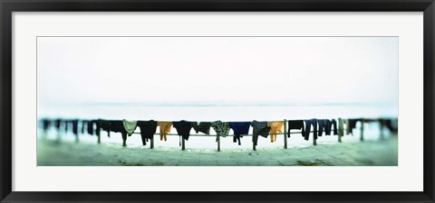 Framed Clothes drying at the riverbank, Ganges River, Varanasi, Uttar Pradesh, India Print