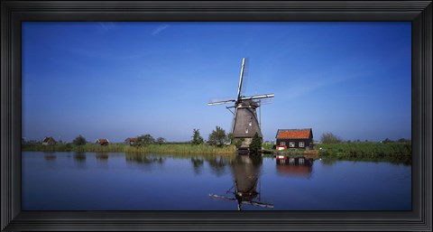 Framed Reflection of a traditional windmill in a lake, Netherlands Print
