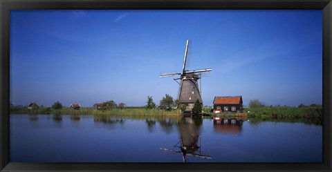 Framed Reflection of a traditional windmill in a lake, Netherlands Print