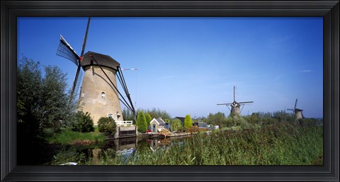 Framed Traditional windmills in a field, Netherlands Print