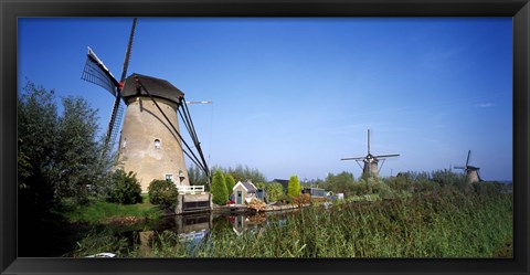 Framed Traditional windmills in a field, Netherlands Print