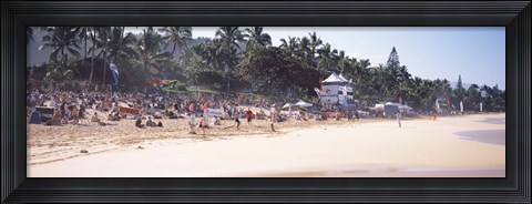 Framed Tourists on the beach, North Shore, Oahu, Hawaii, USA Print