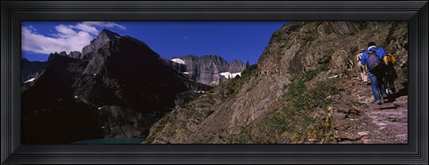 Framed Hikers hiking on a mountain, US Glacier National Park, Montana, USA Print