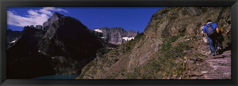 Framed Hikers hiking on a mountain, US Glacier National Park, Montana, USA Print