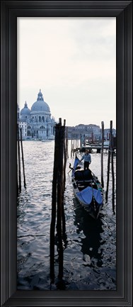 Framed Gondolier in a gondola with a cathedral in the background, Santa Maria Della Salute, Venice, Veneto, Italy Print