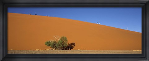 Framed Tourists climbing up a sand dune, Dune 45, Sossusvlei, Namib Desert, Namibia Print