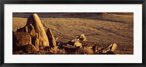 Framed Rocks in a desert, overview of tourist vehicle, Namibia Print