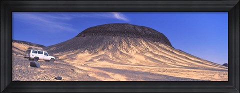 Framed SUV moving in a desert, Black Desert, Bahariya Oasis, Egypt Print