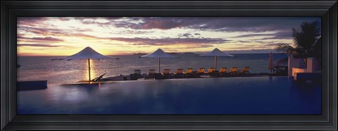 Framed Lounge chairs and patio umbrellas at a tourist resort, Matamanoa Island Resort, Mamanuca Islands, Fiji Print