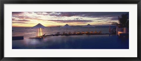 Framed Lounge chairs and patio umbrellas at a tourist resort, Matamanoa Island Resort, Mamanuca Islands, Fiji Print