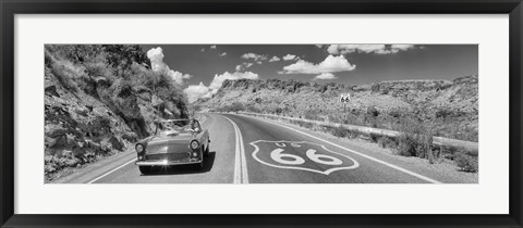 Framed Vintage car moving on Route 66 in black and white, Arizona Print