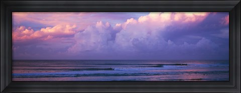 Framed Clouds over the sea at sunset Print