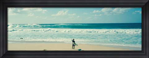Framed Surfer standing on the beach, North Shore, Oahu, Hawaii Print