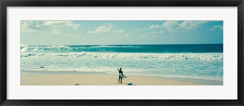 Framed Surfer standing on the beach, North Shore, Oahu, Hawaii Print