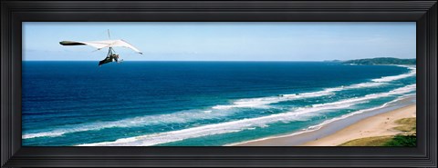 Framed Hang glider over the sea Print