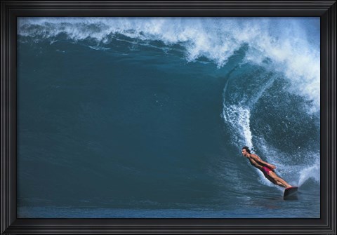 Framed Man surfing in the sea Print
