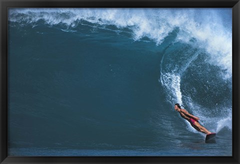 Framed Man surfing in the sea Print