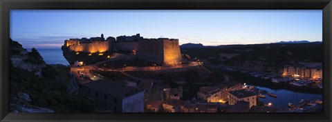 Framed Castle lit up at night, Bonifacio Harbour, Corsica, France Print