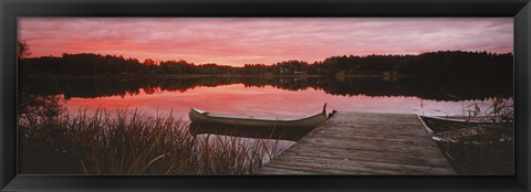 Framed Canoe tied to dock on a small lake at sunset, Sweden Print