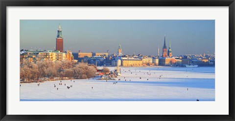 Framed People strolling across frozen Riddarfjarden, Riddarholmen, Stockholm, Sweden Print