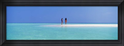 Framed Two women standing on the beach sandbar, Maayafushi Island, Ari Atoll, Maldives Print