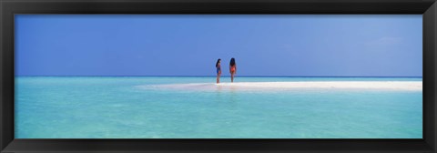 Framed Two women standing on the beach sandbar, Maayafushi Island, Ari Atoll, Maldives Print