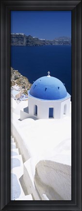 Framed High angle view of a church with blue dome, Oia, Santorini, Cyclades Islands, Greece Print