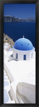 Framed High angle view of a church with blue dome, Oia, Santorini, Cyclades Islands, Greece Print