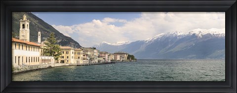 Framed Buildings at the waterfront with snowcapped mountain in the background, Gargnano, Monte Baldo, Lake Garda, Lombardy, Italy Print