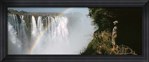 Framed Woman looking at a rainbow over the Victoria Falls, Zimbabwe Print