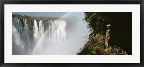 Framed Woman looking at a rainbow over the Victoria Falls, Zimbabwe Print