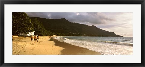 Framed People walking along the Beau Vallon beach, Mahe Island, Seychelles Print