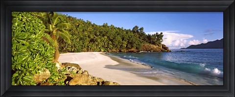 Framed Waves breaking on a small secluded beach on North Island, Seychelles Print