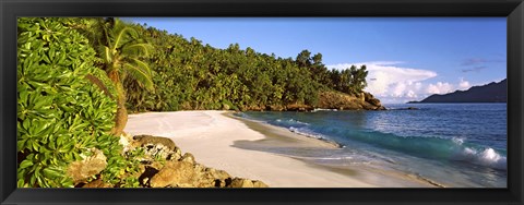 Framed Waves breaking on a small secluded beach on North Island, Seychelles Print