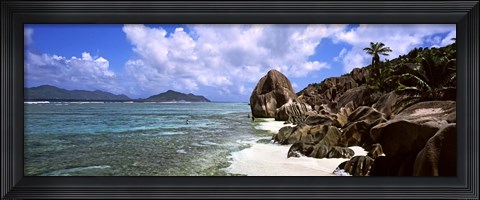 Framed Rock formations on the beach on Anse Source d&#39;Argent beach with Praslin Island in the background, La Digue Island, Seychelles Print