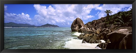 Framed Rock formations on the beach on Anse Source d&#39;Argent beach with Praslin Island in the background, La Digue Island, Seychelles Print