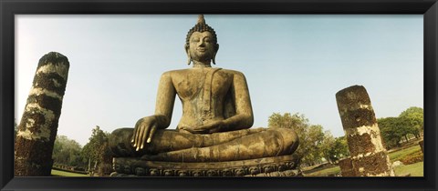 Framed Low angle view of a statue of Buddha, Sukhothai Historical Park, Sukhothai, Thailand Print