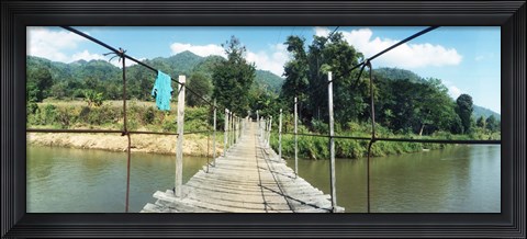 Framed Old wooden bridge across the river, Chiang Mai Province, Thailand Print