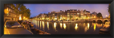 Framed Night view along canal, Amsterdam, Netherlands Print